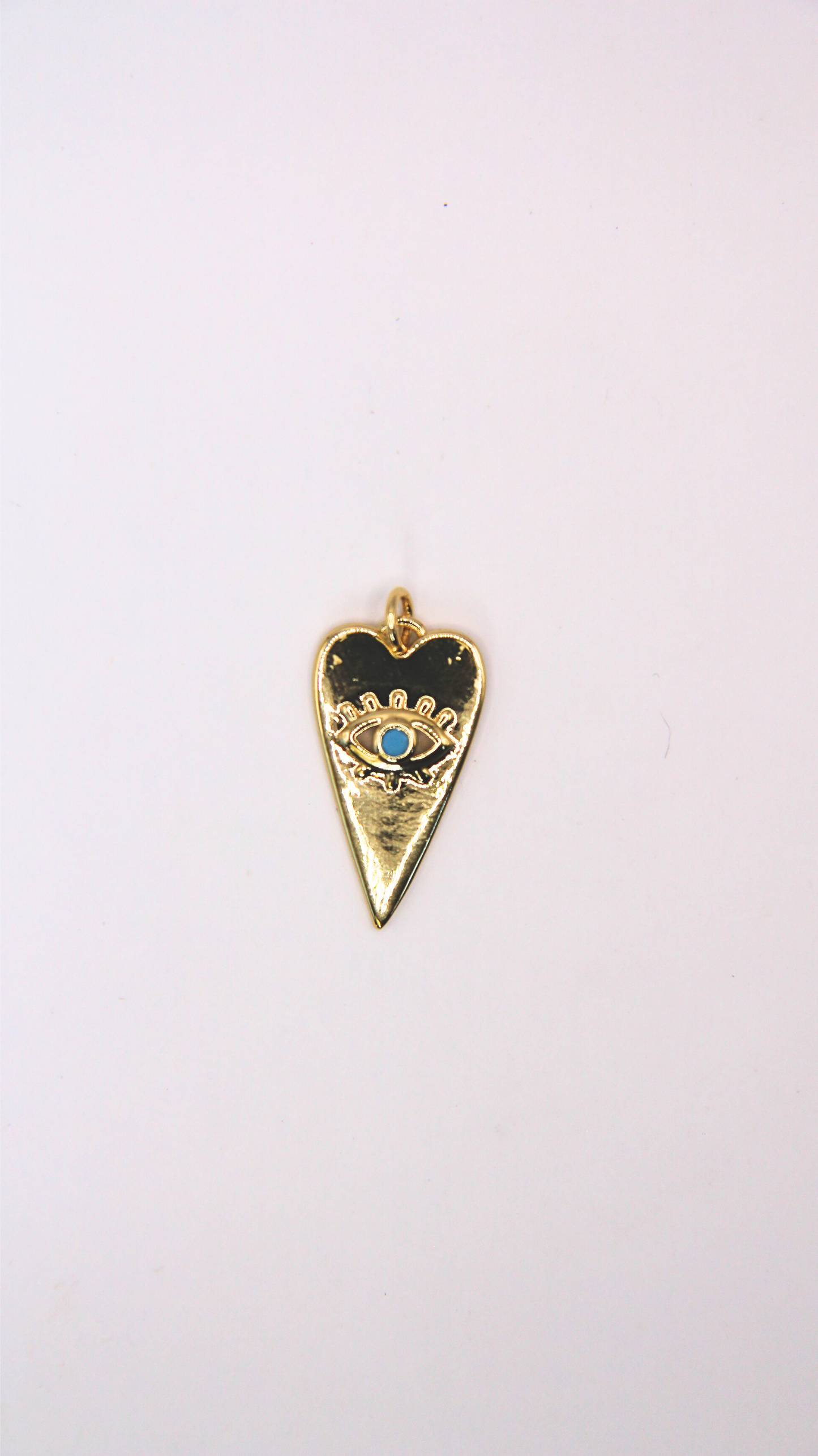 The Turquoise Heart Evil Eye Charm