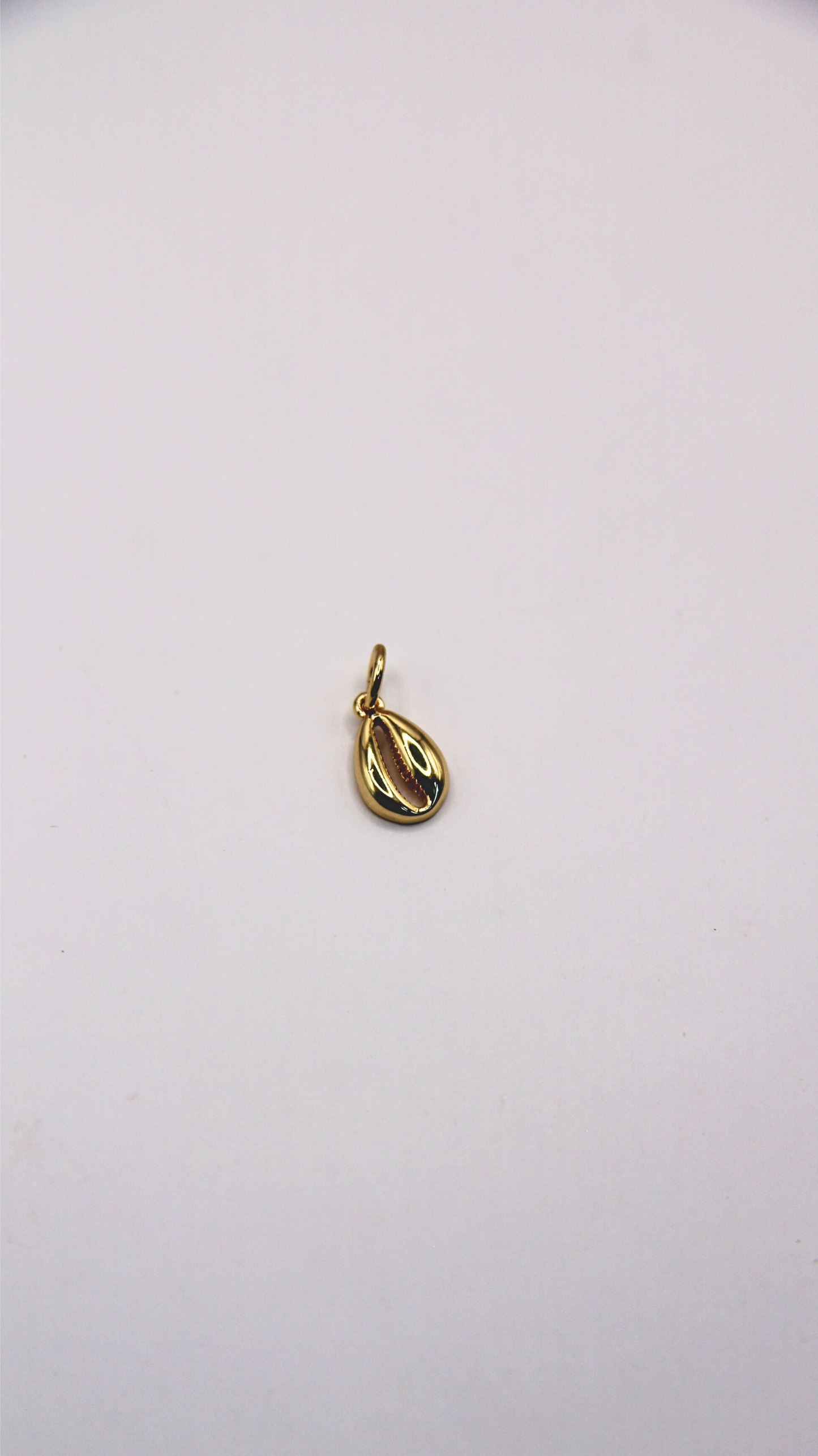 The Gold Cowrie Shell Charm